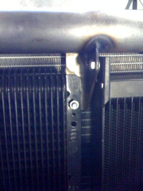 1994 Jeep YJ - Radiator and mounting bracket detail, likely from a vehicle's engine bay.