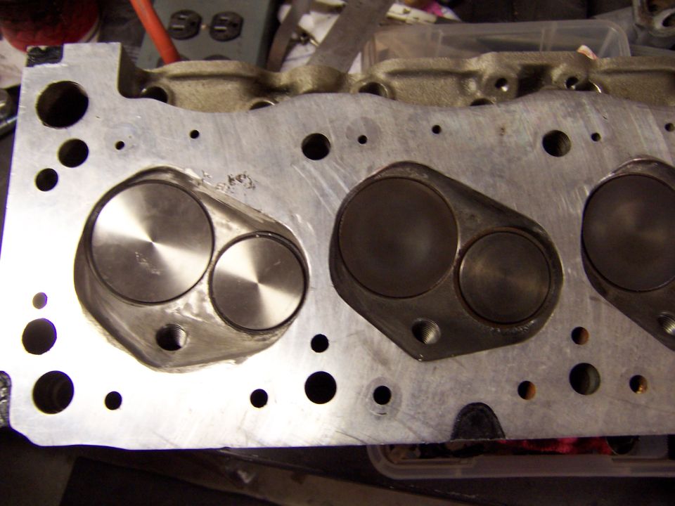 Aluminum engine cylinder head with two intake and two exhaust valves visible
