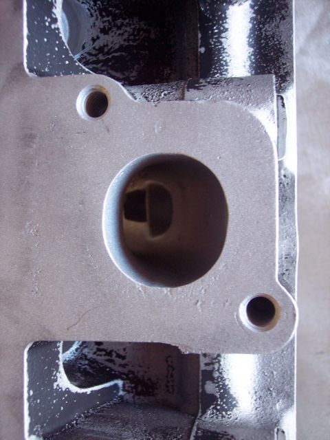 1971 Ford Mustang - Engine cylinder head port detail, showing the opening and mounting holes.