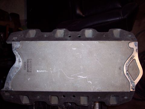 1971 Ford Mustang - Close-up of an engine intake manifold, showing casting marks and part numbers.