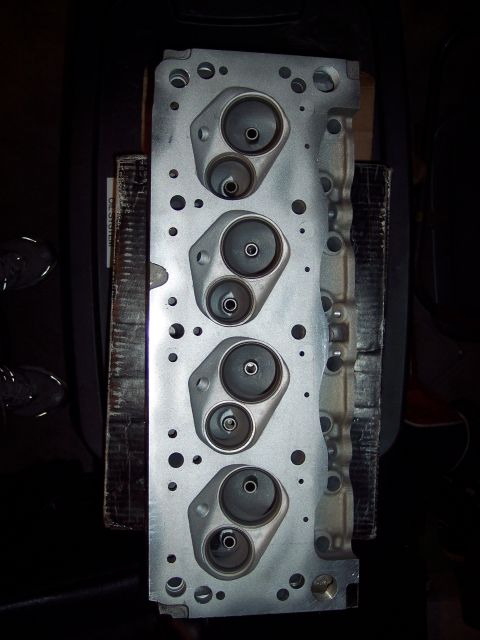 1971 Ford Mustang - Close-up of an engine cylinder head, showing intake and exhaust ports.