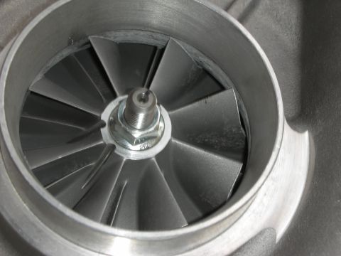 1998 Ford Crown Victoria - Close-up view of a turbocharger's compressor wheel, showing its angled blades.