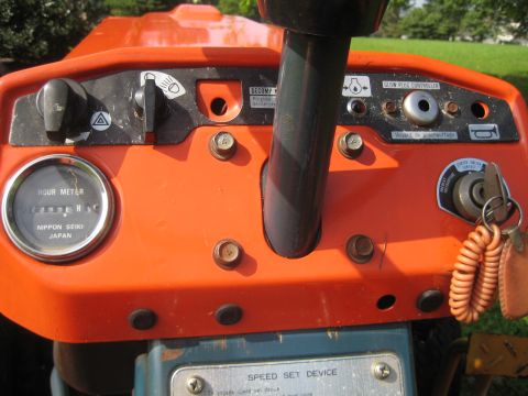 1993 Ford Probe - Close-up of a tractor's dashboard, showing the hour meter and various controls.