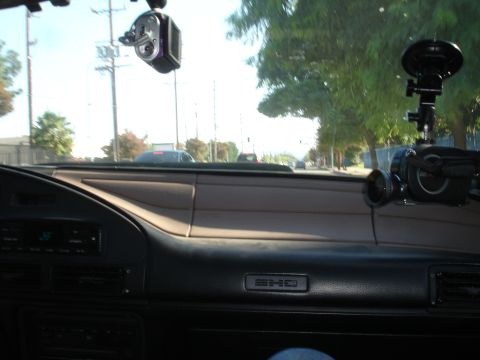 1993 Ford Taurus - Interior view of a 1993 Ford Taurus dashboard, equipped with two camera mounts.