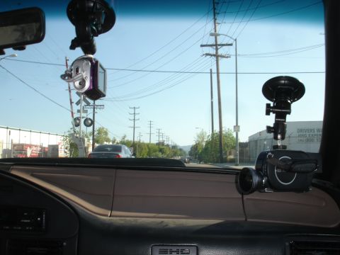 1993 Ford Taurus - Interior view from a car, dashboard-mounted cameras and a dangling decoration.