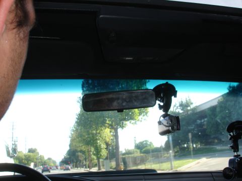 1993 Ford Taurus - View from inside a car, showing the rearview mirror and a dashcam mounted on the windshield.