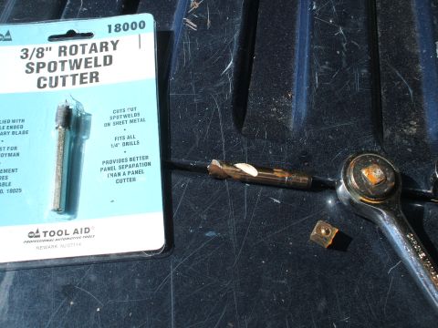 1990 Ford Bronco - A Tool Aid 3/8" rotary spotweld cutter is shown with a drill bit and a socket wrench, likely for automotive repair.