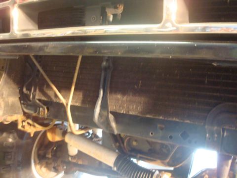 1995 Ford Bronco - Underside view of a vehicle's front end, showing the radiator and suspension system.