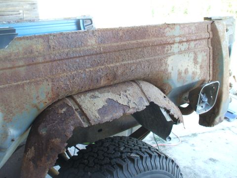 1990 Ford Bronco - The extensive rust on this vehicle's body suggests it is not a 1990 model and requires significant restoration.