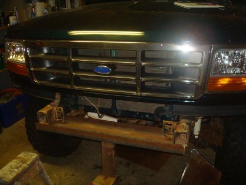 1995 Ford Bronco - Front view of a green Ford Bronco showing its grille and an aftermarket bumper.
