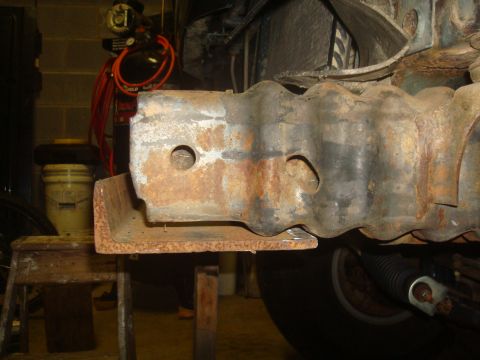1995 Ford Bronco - Close-up of a heavily rusted metal frame component, with the SuperMotors.net logo visible at the bottom right.