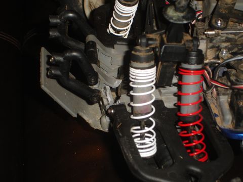 1989 Ford Bronco - Suspension parts of a remote control car, showing shocks and linkages.