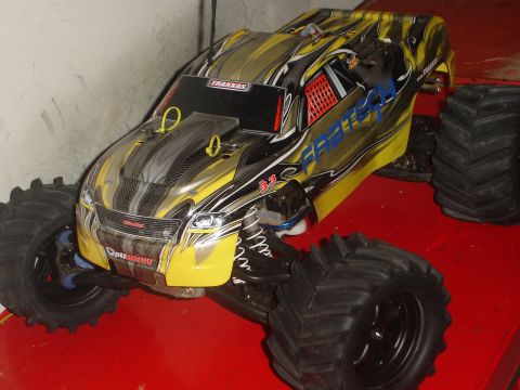 1989 Ford Bronco - Remote control monster truck with custom graphics and oversized tires.