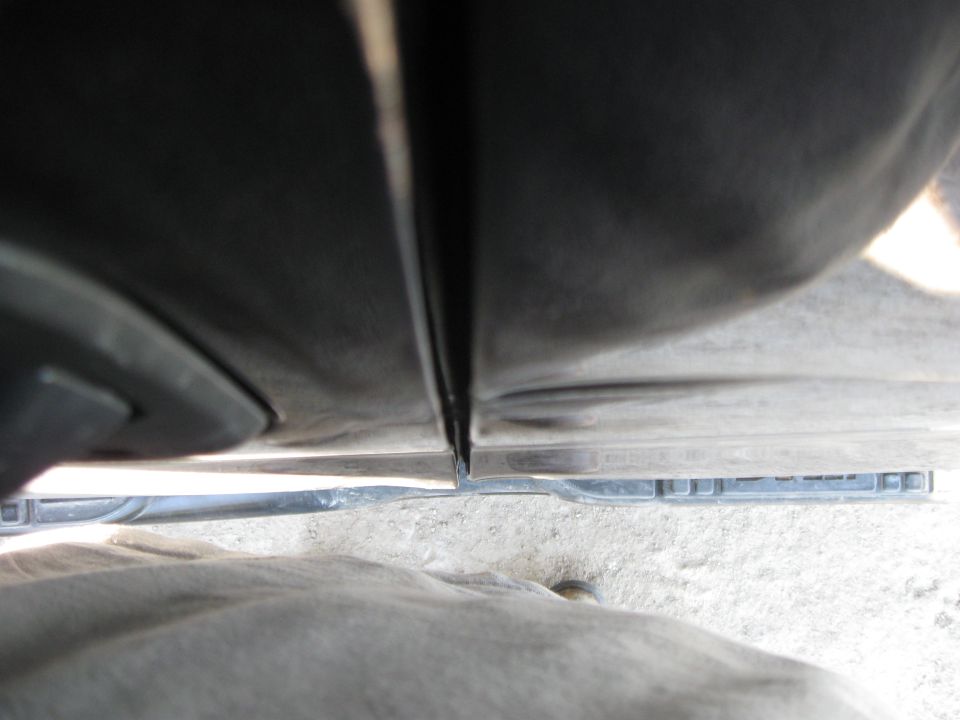 Close-up of the seam between two truck doors, showing the gap and trim