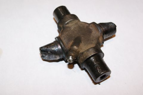 1995 Ford Bronco - This is a universal joint, a mechanical component used to transmit power between rotating shafts.