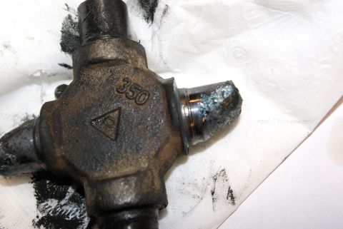 1995 Ford Bronco - Close-up of a U-joint with visible damage to one of its yokes.