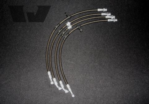 2004 Subaru Impreza - A set of braided stainless steel brake lines is displayed against a dark, textured background.