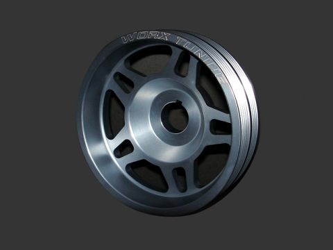 2004 Subaru Impreza - A single aluminum pulley with engraved text is shown against a dark background.