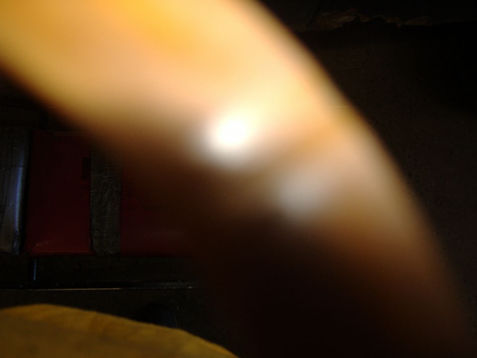 Blurred dark out-of-focus photo with no identifiable subject