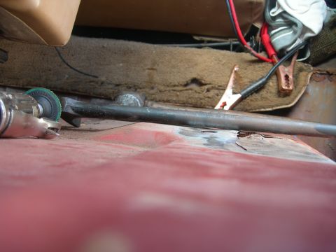 1984 Ford Bronco - Tools and jumper cables are present in the vehicle's interior, indicating repair work is underway.