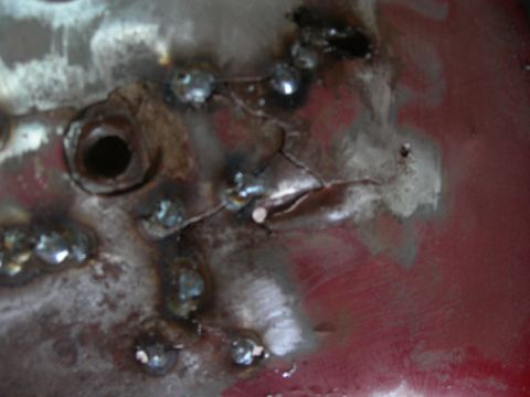 1984 Ford Bronco - This image shows a section of damaged and repaired metal, not a vehicle.