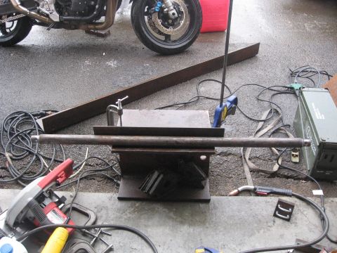1990 Ford F-250 - Metalworking setup with a motorcycle in the background, ready for fabrication.