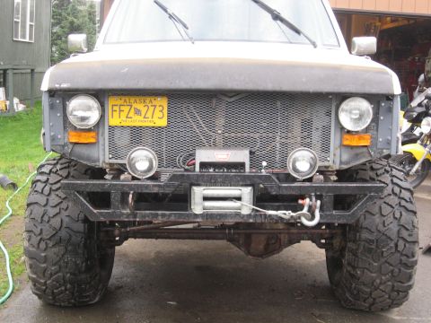 1990 Ford F-250 - This heavily modified Ford truck features a custom bumper and winch, suggesting it's built for off-road use.