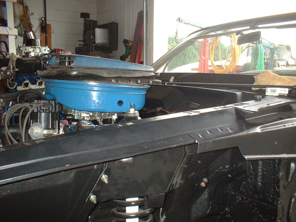1970 Ford Torino engine bay showing blue air cleaner and carburetor
