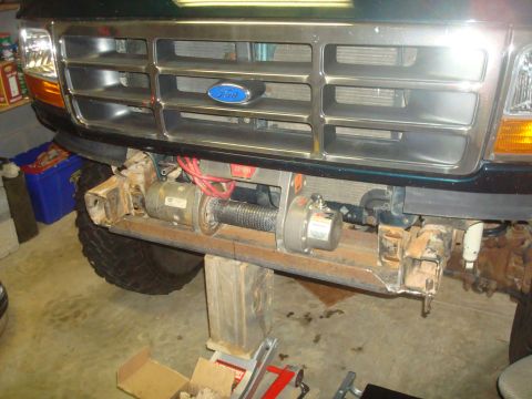 1995 Ford Bronco - Front view of a 1995 Ford Bronco showing the grille and an aftermarket winch mounted to the bumper.