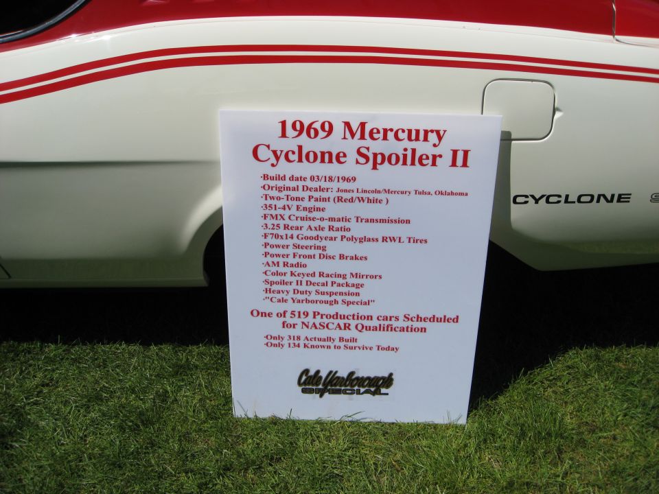 White and red Mercury Cyclone Spoiler II with a sign detailing its specifications