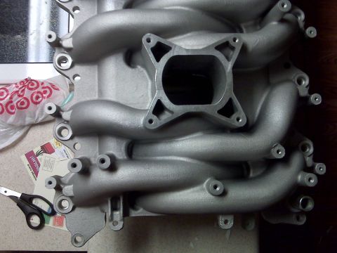 2001 Ford Crown Victoria - Close-up of an aluminum intake manifold, likely for a V8 engine.