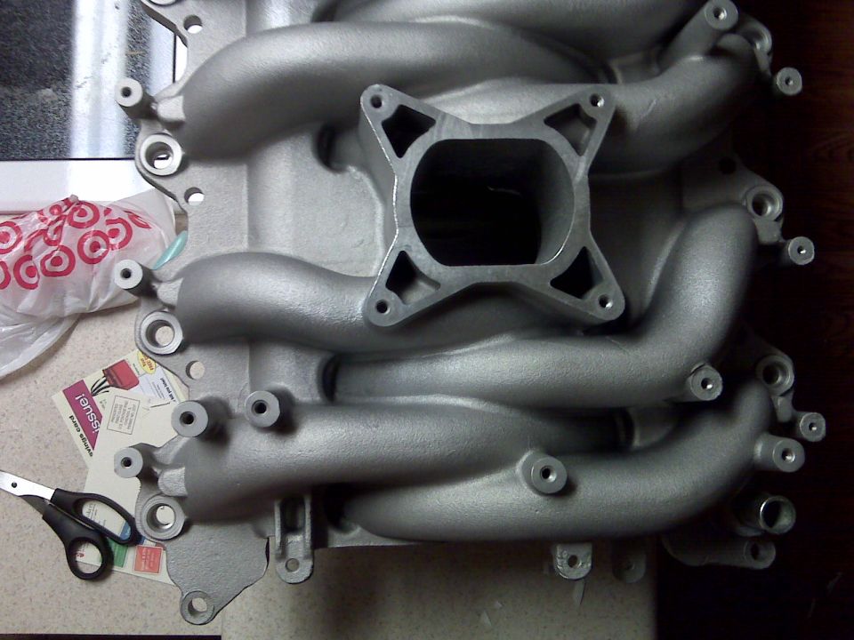 Aluminum intake manifold with four runners and a square mounting flange