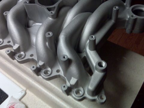 2001 Ford Crown Victoria - This is a close-up view of an aluminum intake manifold, likely a performance part.