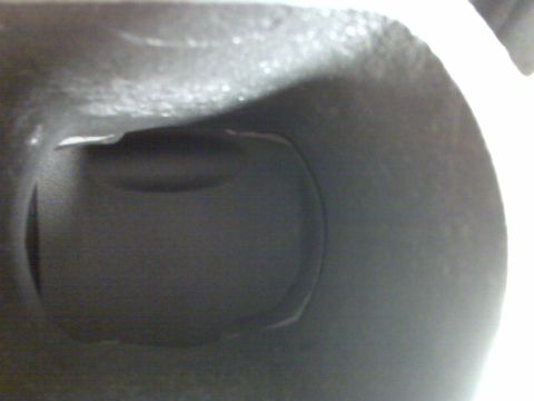 2001 Ford Crown Victoria - Close-up view of an engine intake port, showing its internal shape and texture.