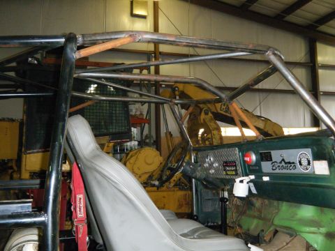 1978 Ford Bronco - Custom roll cage installed in the interior of a 1978 Ford Bronco, a modified dashboard.