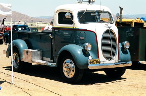 1981 Kenworth W900A - A vintage truck with a distinctive grille and two-tone paint is parked outdoors.