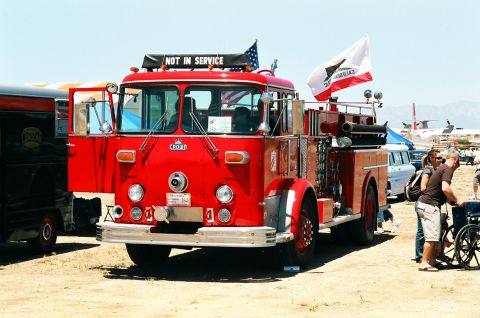 1981 Kenworth W900A - A vintage red fire truck is parked outdoors, with a sign indicating it is not in service.