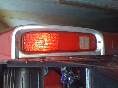 1978 Ford Bronco - Close-up view of a vehicle's red taillight assembly, a chrome bezel.