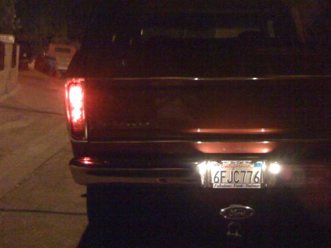 1978 Ford Bronco - The rear of a 1978 Ford Bronco is visible, a California license plate and Ford emblem.
