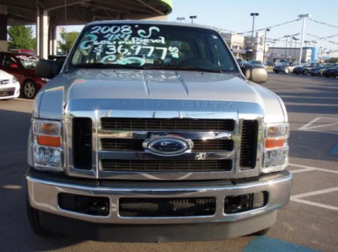 2008 Ford F-250 - A silver Ford Super Duty truck is parked in a lot, with a price and year written on the windshield.