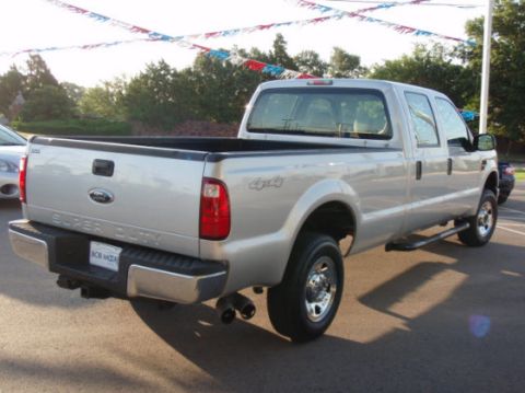 2008 Ford F-250 - This silver 2008 Ford F-250 Super Duty pickup truck is viewed from the rear three-quarter angle.