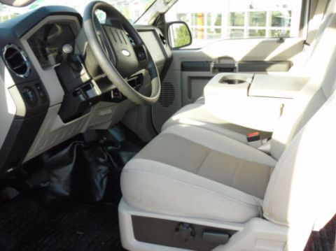 2008 Ford F-250 - The interior of a truck shows the driver's side dashboard, steering wheel, and front seats.