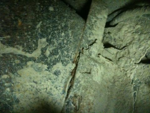 1993 Ford Bronco - Close-up view of a heavily rusted vehicle frame and undercarriage, with a Supermotors.net watermark visible.