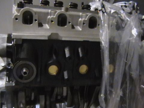 1996 Ford Bronco - Close-up of an engine block, showing internal components and cylinder head.