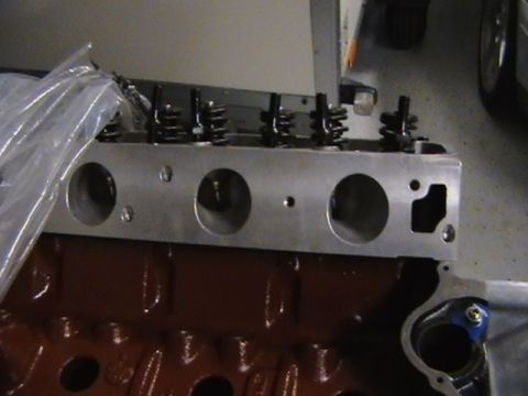1996 Ford Bronco - Close-up view of an engine block paired with an aluminum cylinder head, showing valve springs and intake ports.