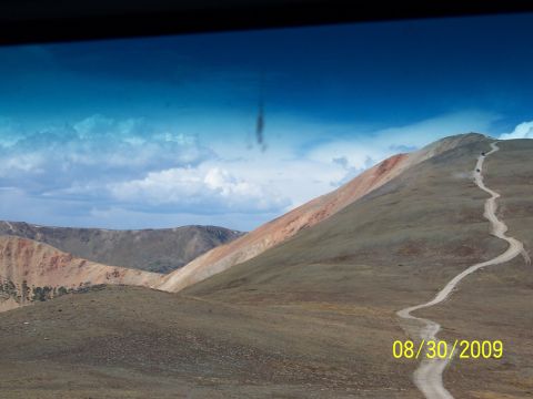 1994 Ford Bronco - Vehicles ascend a remote mountain road, with the date 08/30/2009 visible in the corner.