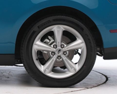 1971 Ford Ranchero - The rear wheel and fender of a blue vehicle are shown. A watermark reads 'SUPERMOTORS'.