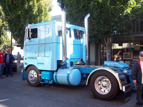 1981 Kenworth W900A - A classic blue 1981 Kenworth W900A semi-truck is displayed, its iconic design.