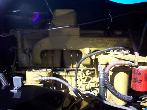 1981 Kenworth W900A - Close-up of a yellow engine, showing the firing order and part numbers.