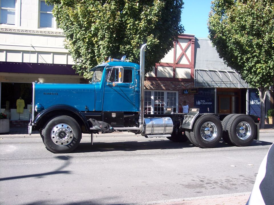 Blue 1981 Kenworth W900A semi-truck, side view, chrome exhaust stack, chrome fuel tank